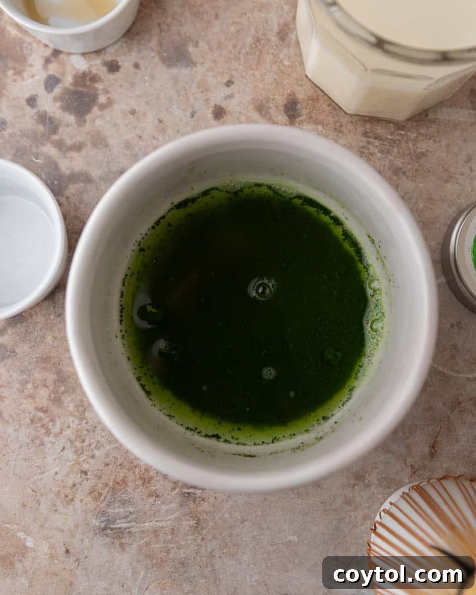 Velvety Salted Maple Matcha Frost 4 Matcha mixed with warm water before whisking