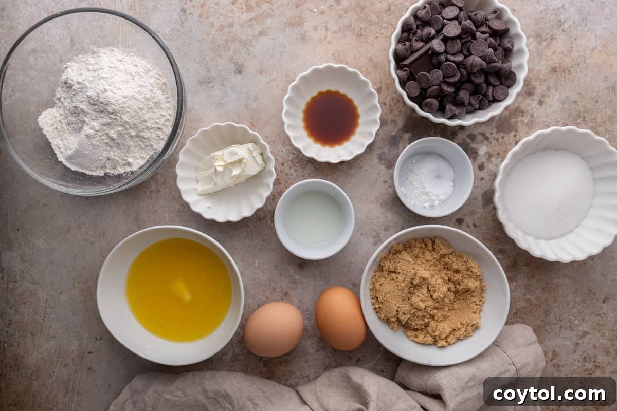 Ingredients for cream cheese chocolate chip cookies arranged on a countertop