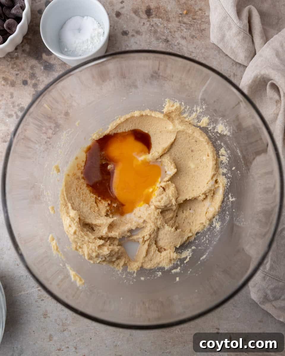 Egg yolks and vanilla added to cream cheese mixture