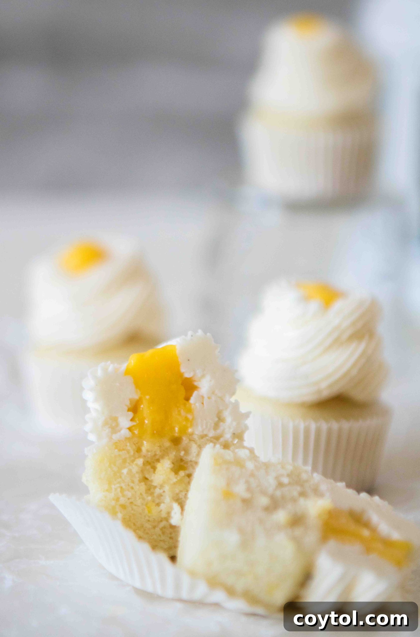 Close-up of lemon curd filled mini lemon cupcakes