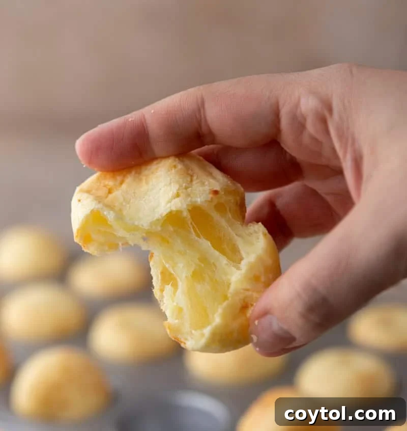 Steakhouse-style Brazilian cheese bread torn open showing 