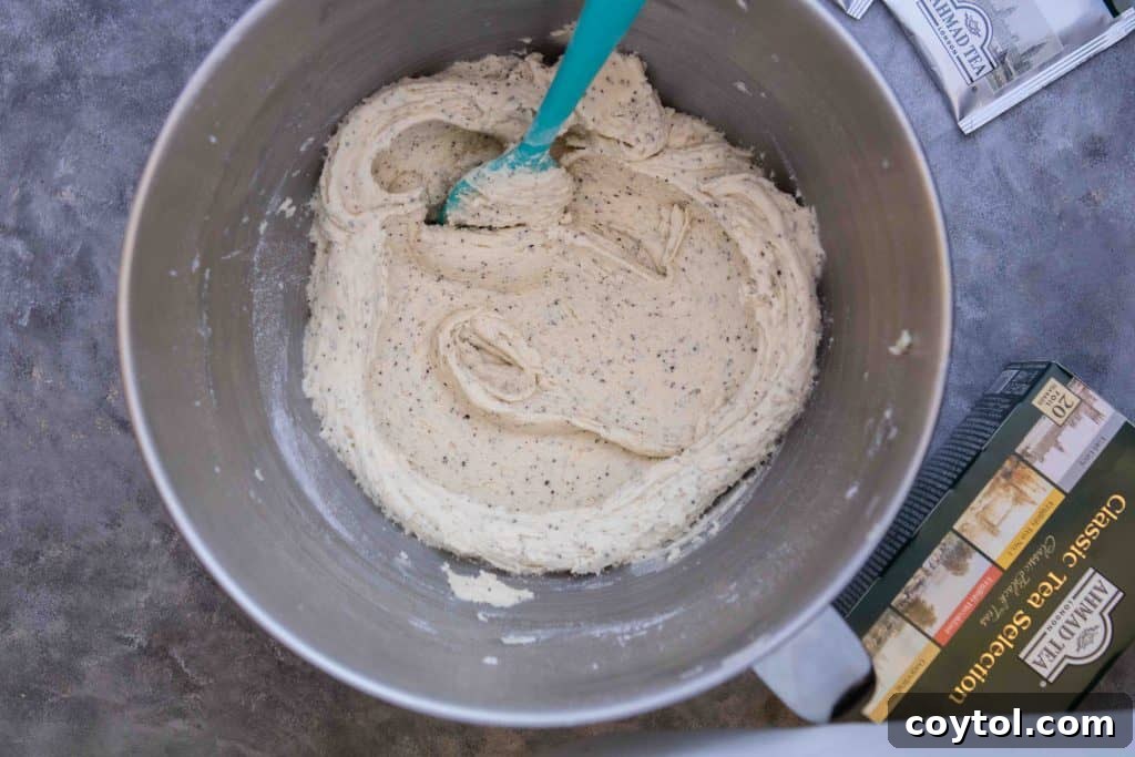 Mixing wet ingredients for Earl Grey sugar cookies in a stand mixer.