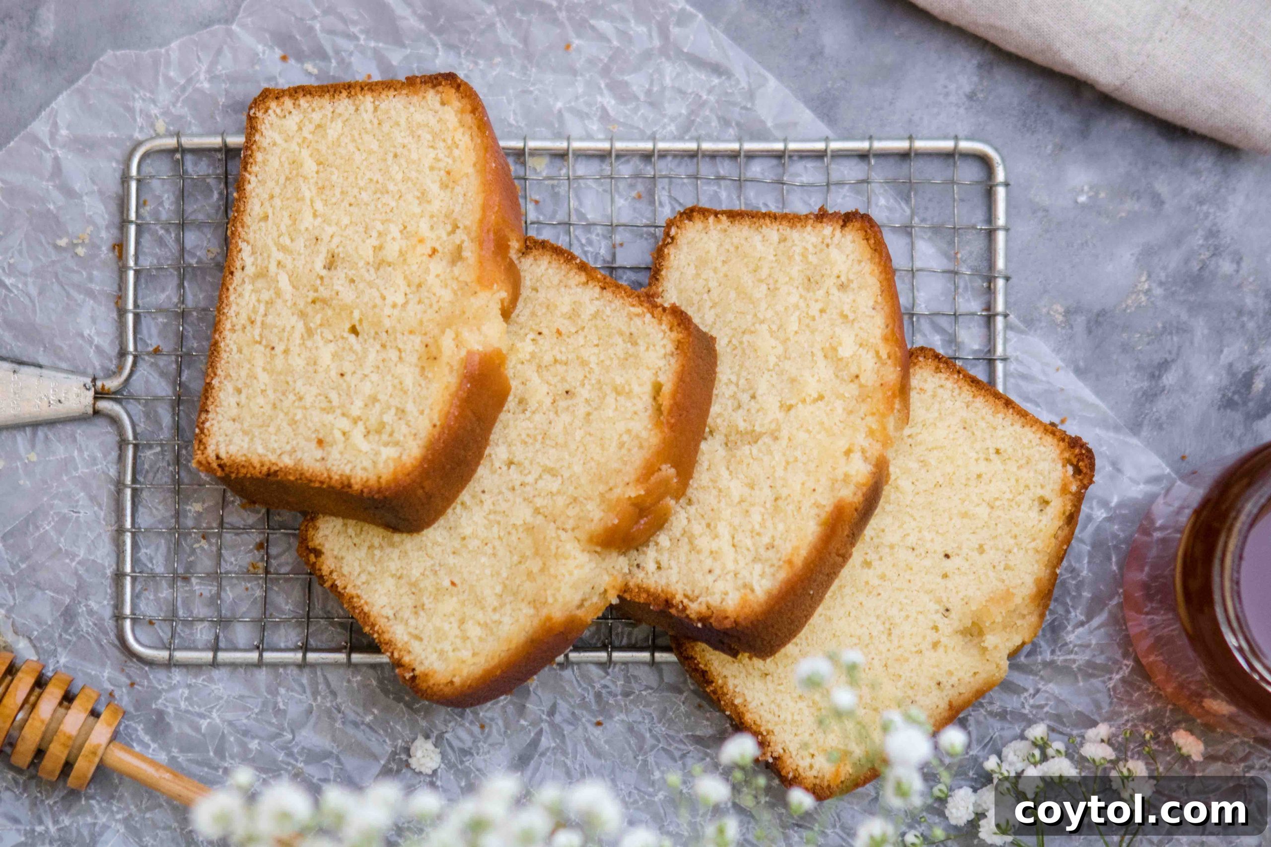 Grandma's Secret Moist Honey Tea Cake Loaf 3 Slices of Easy Delicious Honey Tea Cake Loaf on a wooden board