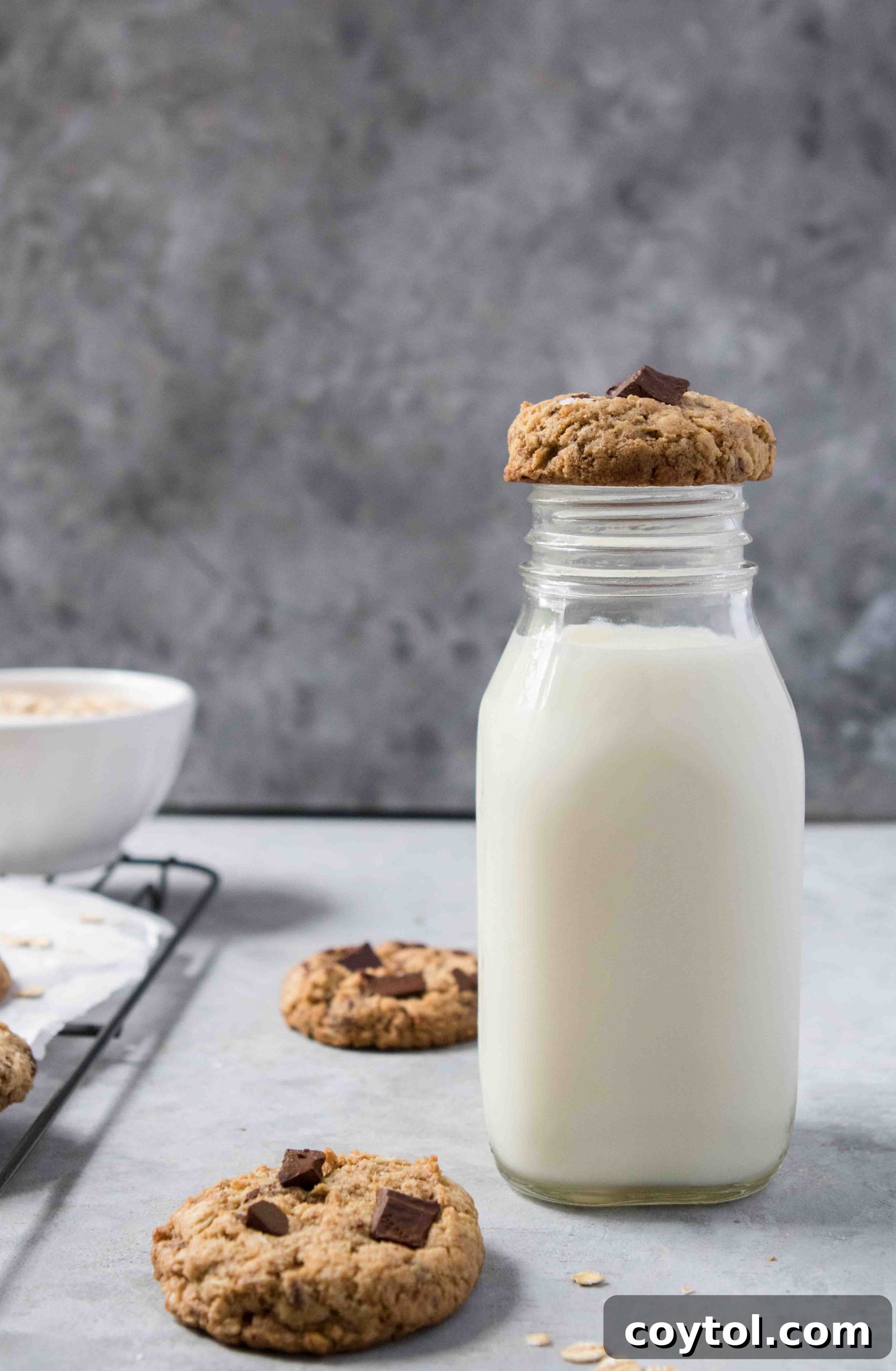 Irresistibly Soft and Chewy Chocolate Chip Oatmeal Cookies 4 A close-up of a soft and chewy oatmeal chocolate chip cookie, sprinkled with sea salt.