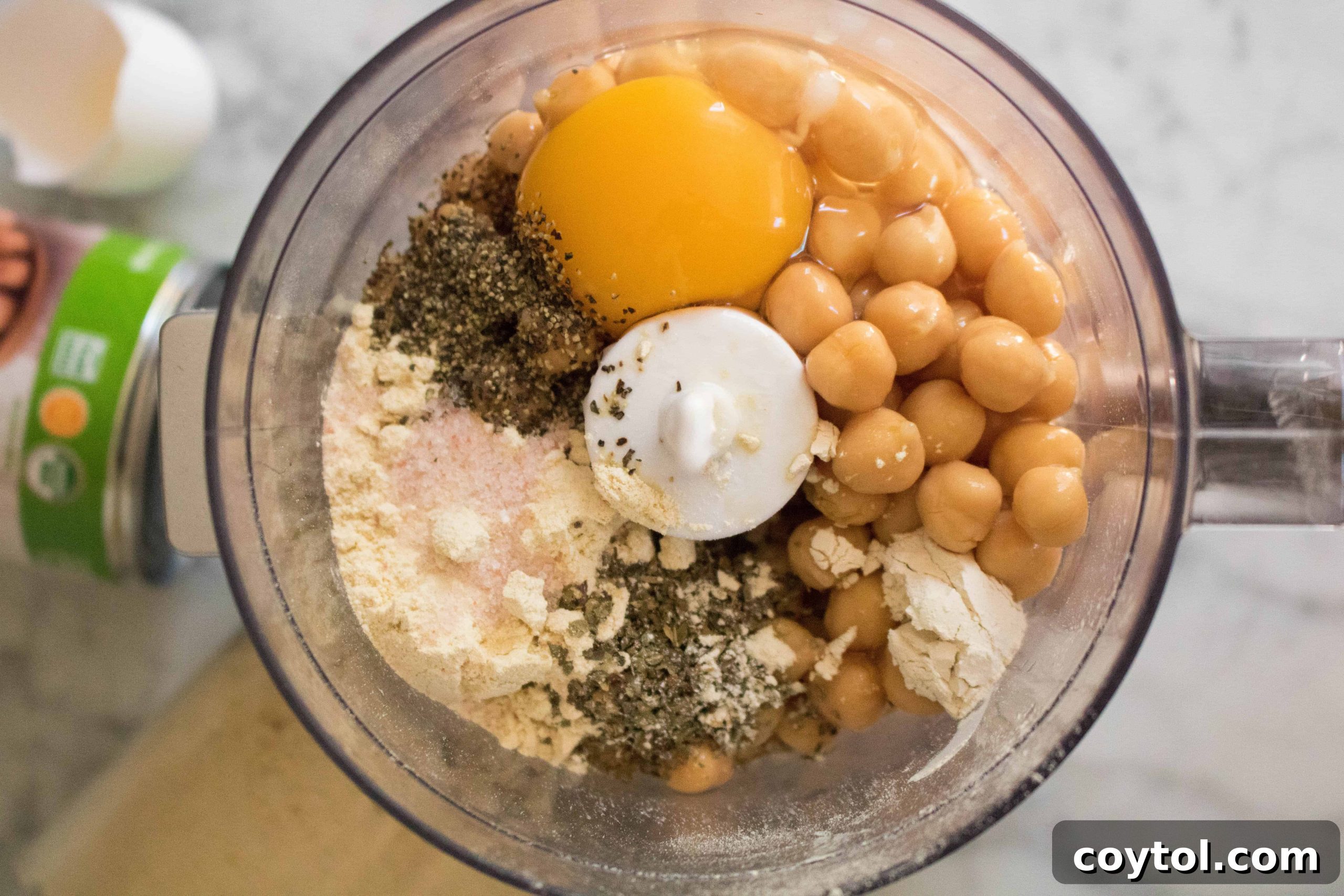Food processor blending chickpea pizza crust ingredients