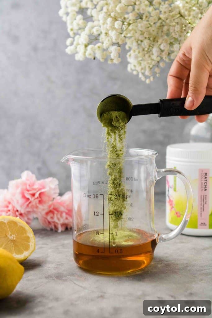 Adding matcha powder to the simple syrup mixture