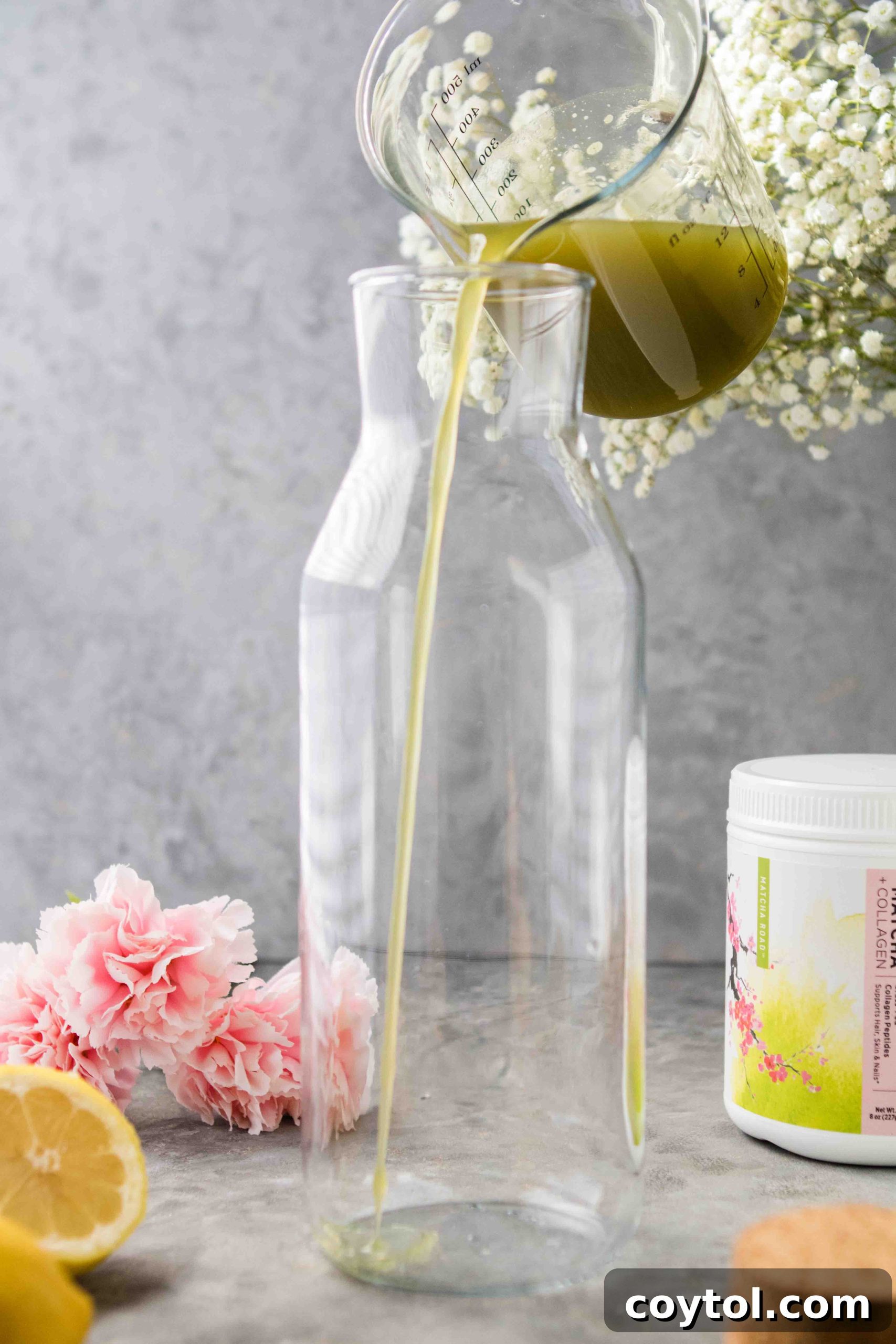 Transferring matcha lemon mixture to a large glass pitcher