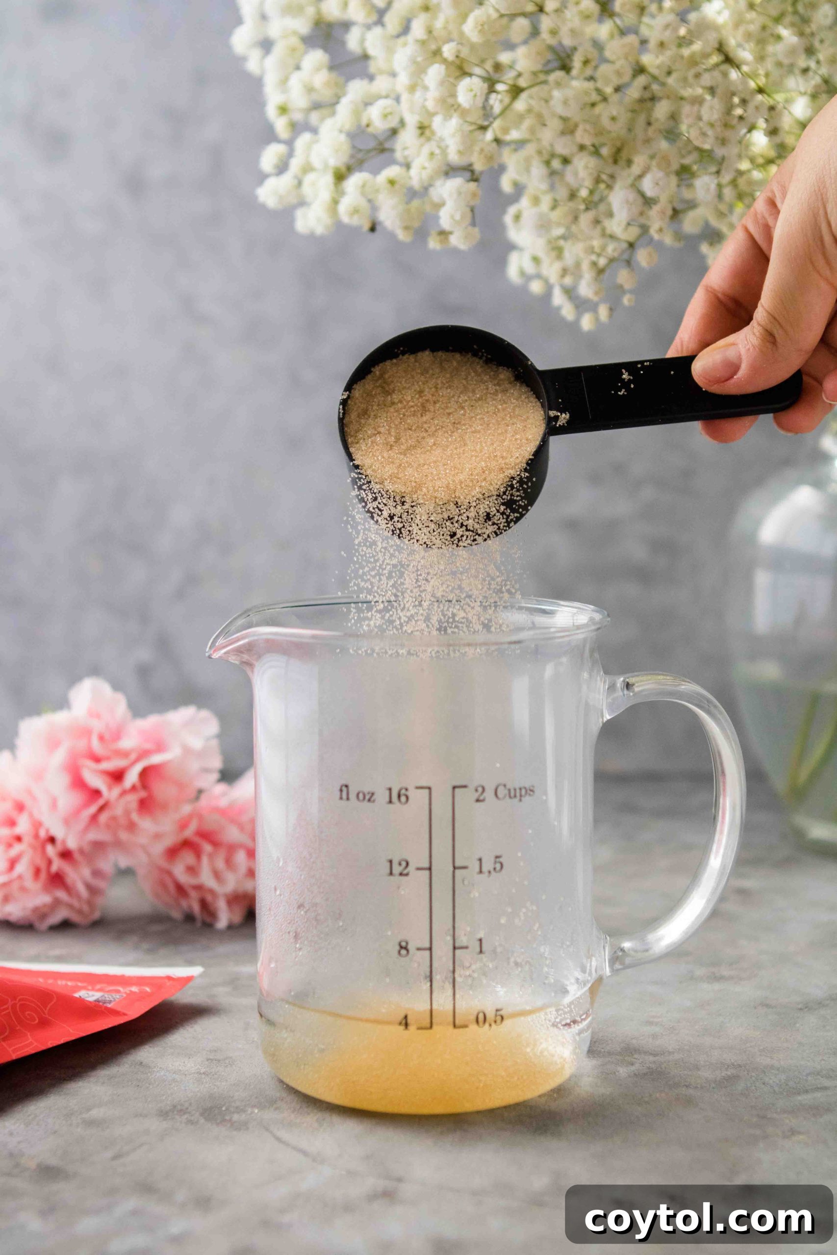Mixing sweetener into hot water for simple syrup