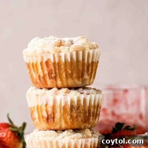 Stack of strawberry muffins with a delicious streusel topping.