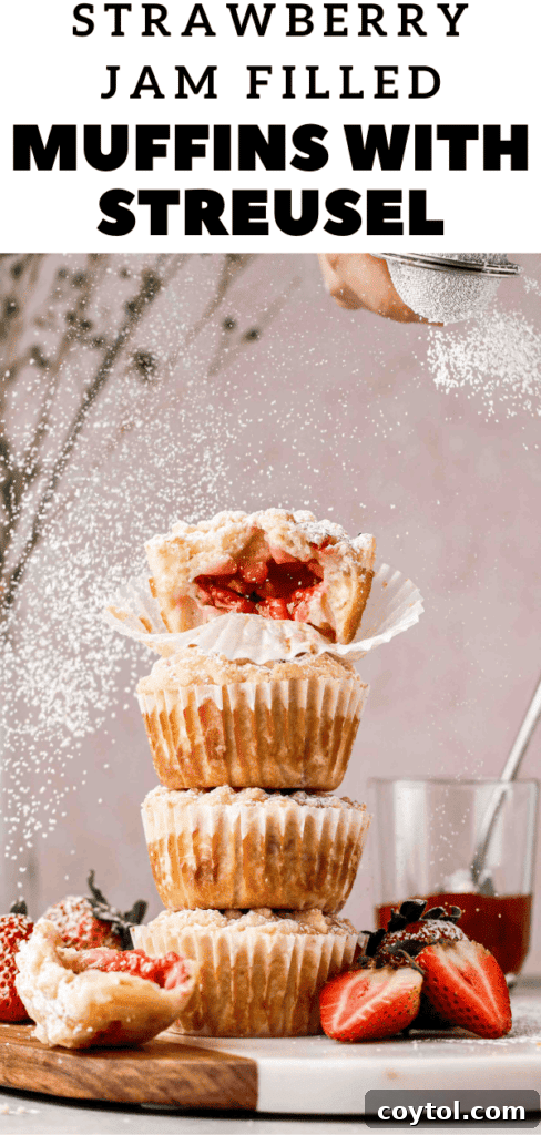 Close-up of baked strawberry muffins with a golden streusel, ideal for pinning to your dessert board.