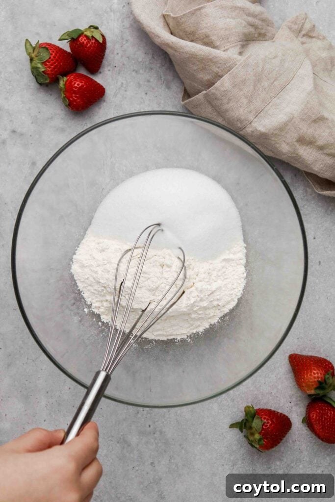 Dry ingredients mixed together in a large bowl, ready for the wet mixture.