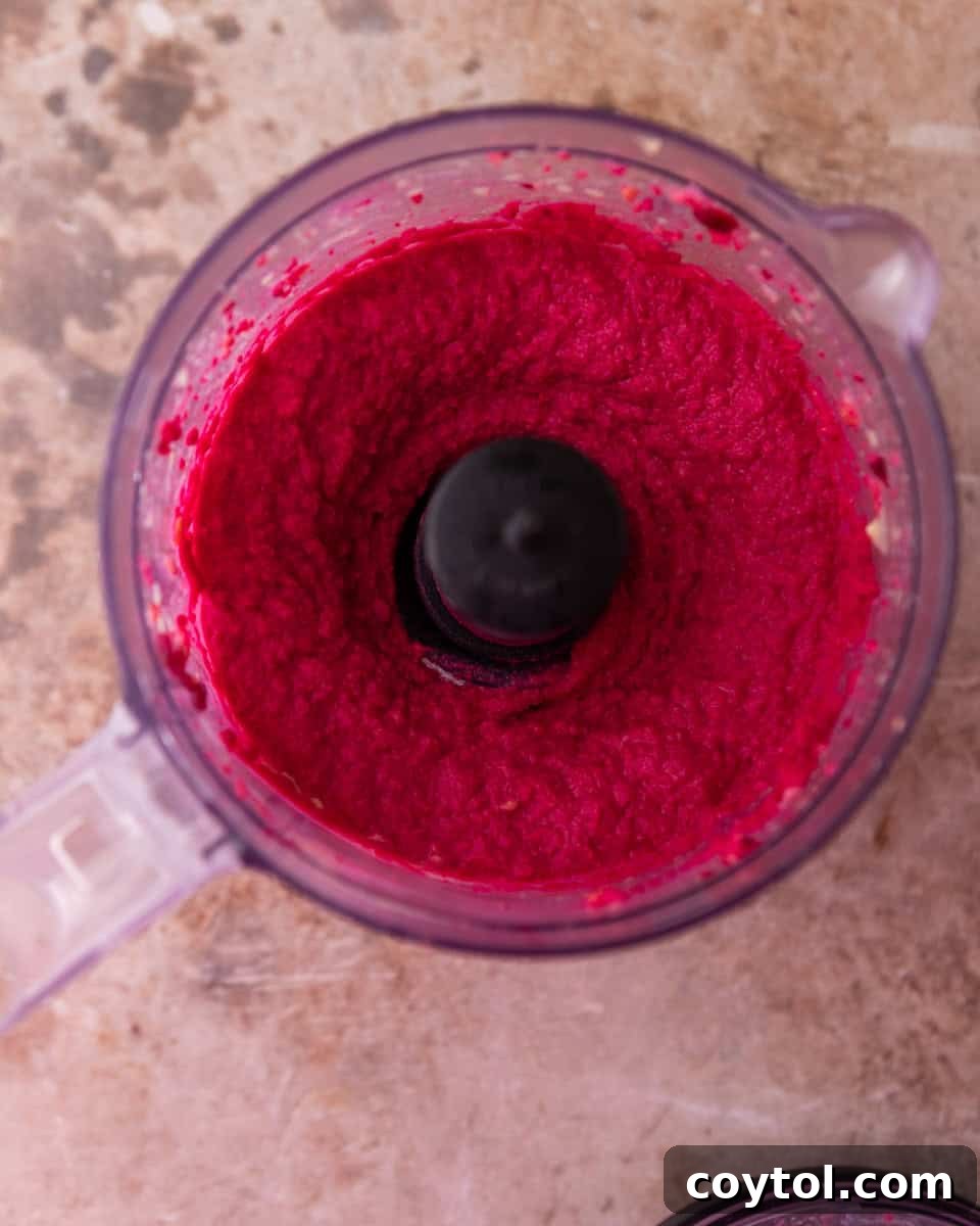 Creamy beet hummus blended in a food processor
