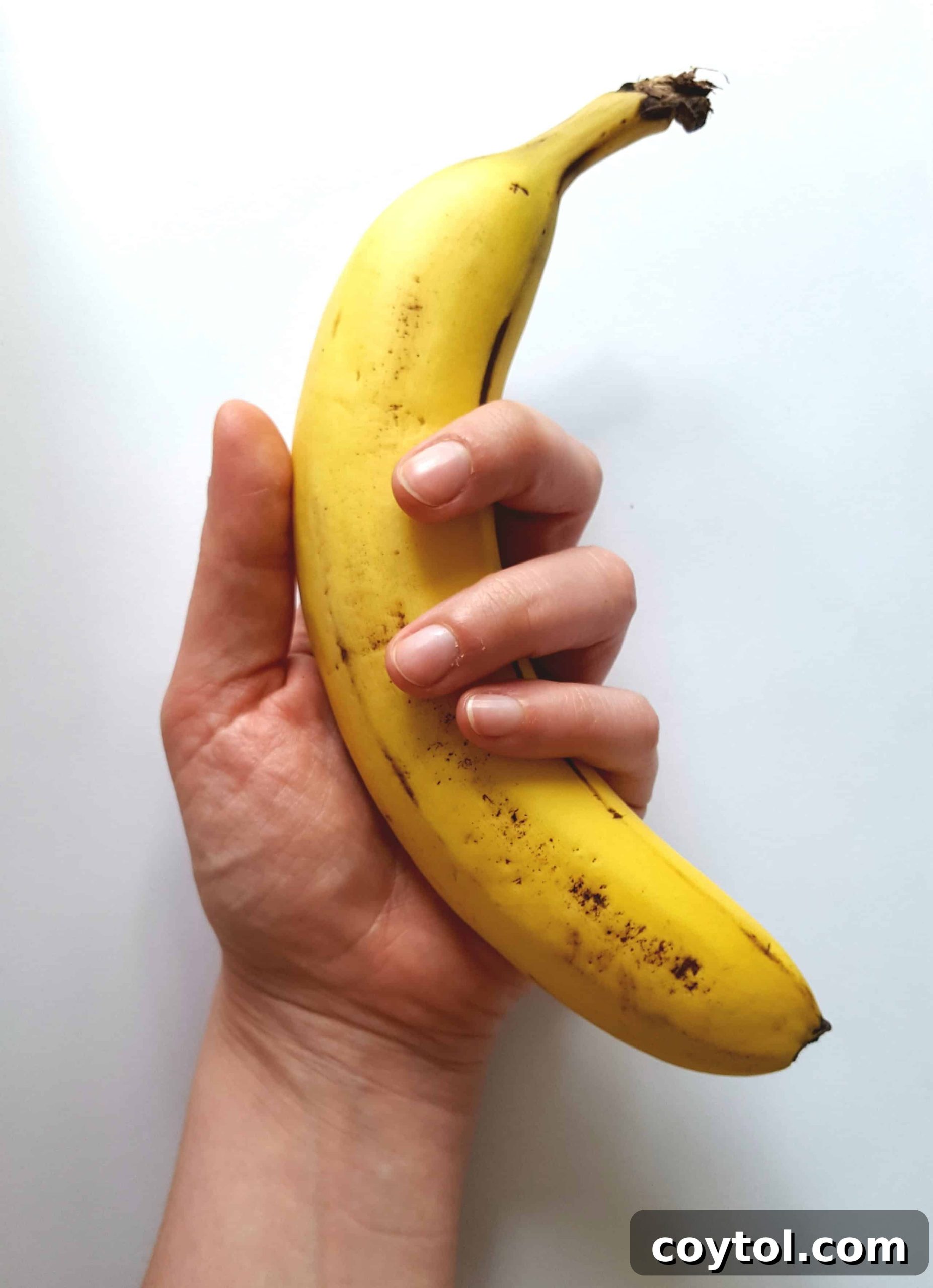 Close-up of a ripe banana, a natural egg replacer for moisture and binding.