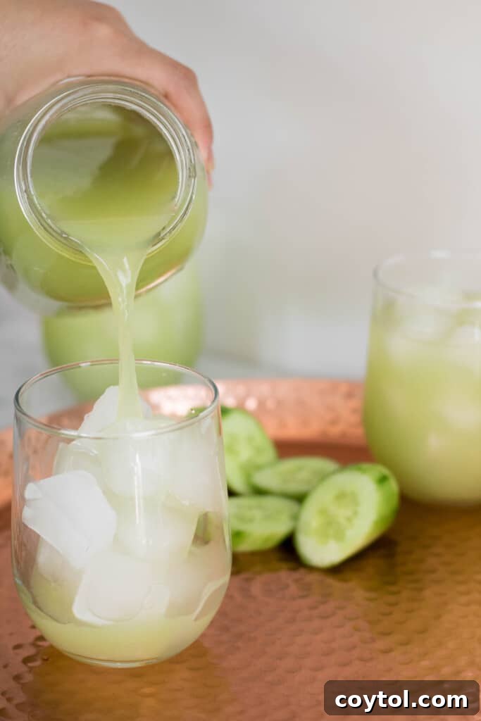 Pouring grape juice in an ice cup