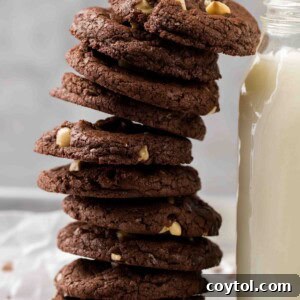 Easy brownie hazelnut cookie stack next to milk