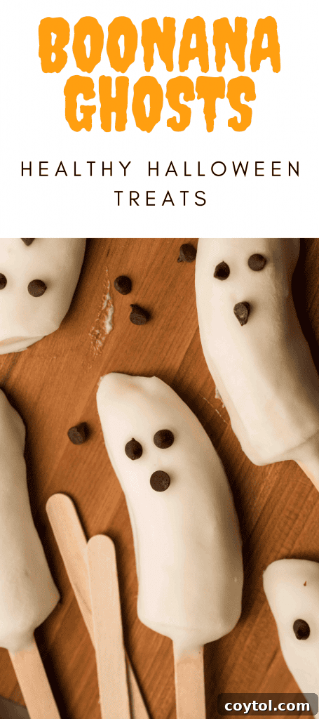 Pin for later: Healthy Halloween banana ghost, a Boonana with a perfect yogurt coating and chocolate chip eyes.