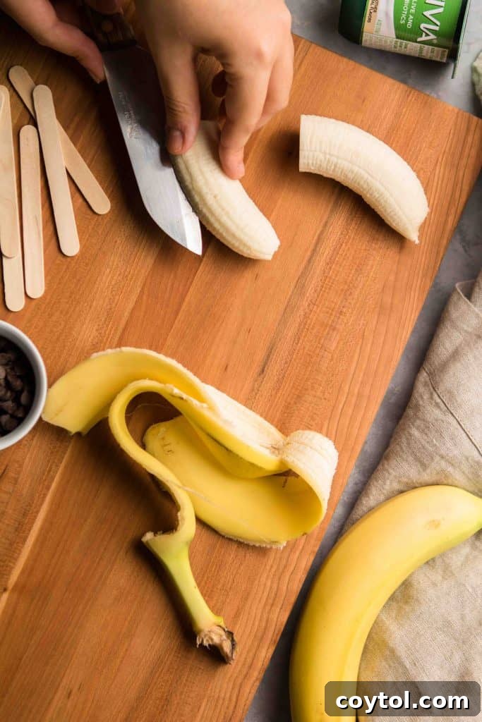 Step-by-step image showing frozen bananas being dipped in vanilla yogurt for Boonanas.