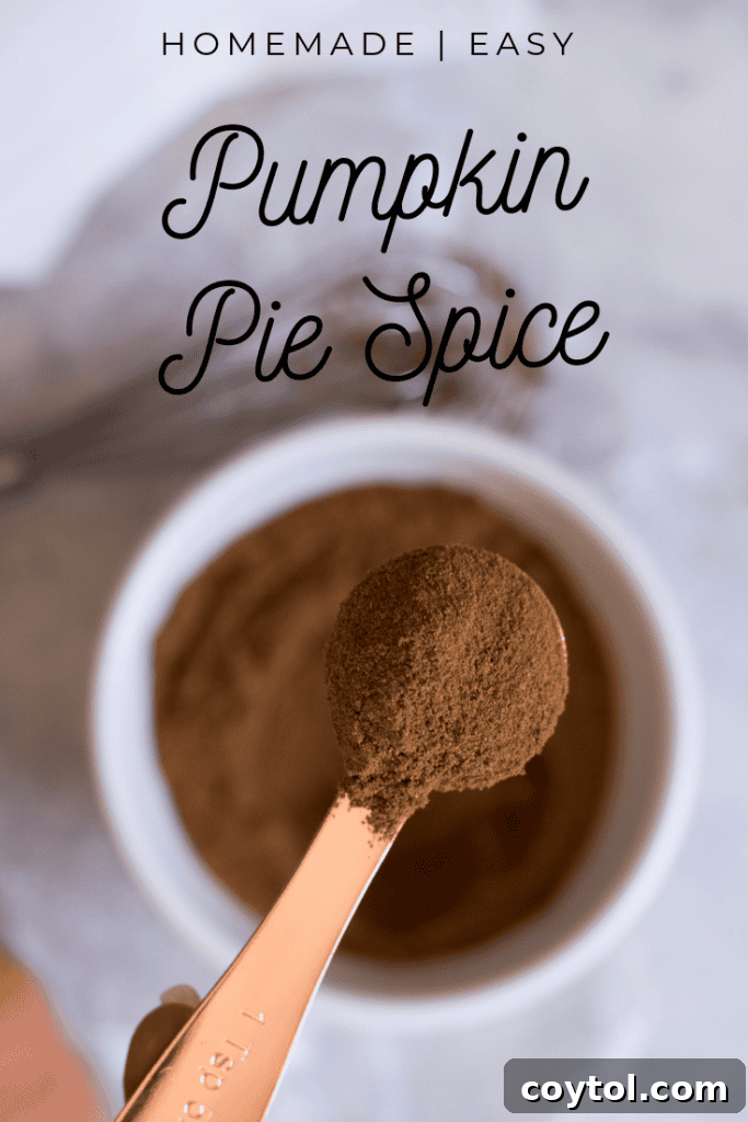 A Pinterest-friendly vertical image showcasing homemade pumpkin pie spice in a jar, with fall leaves and ingredients in the background, prompting users to 'Pin it for later'.