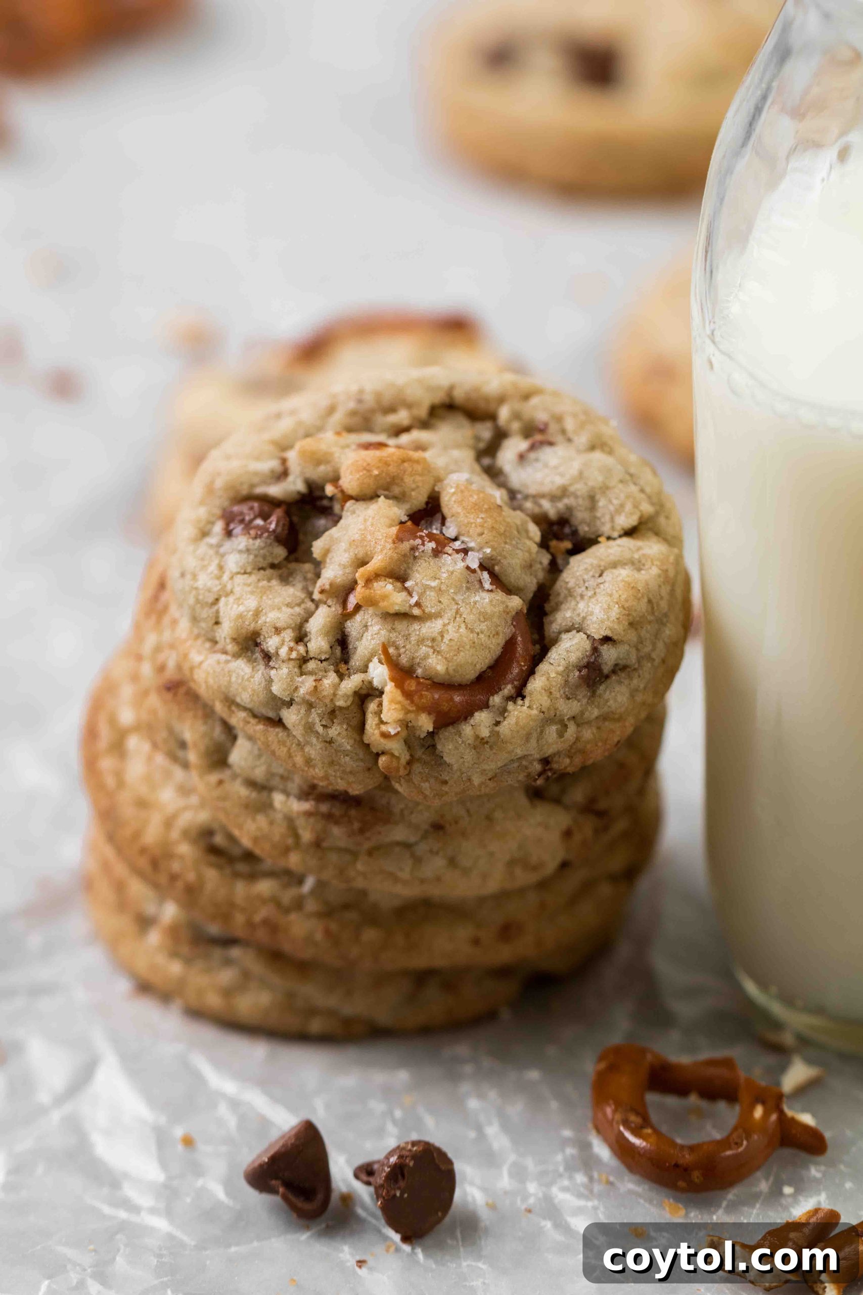Stack of soft and chewy pretzel chocolate chip cookies with a drizzle of chocolate