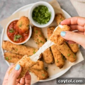 Air fryer cheese stick with cheese oozing out