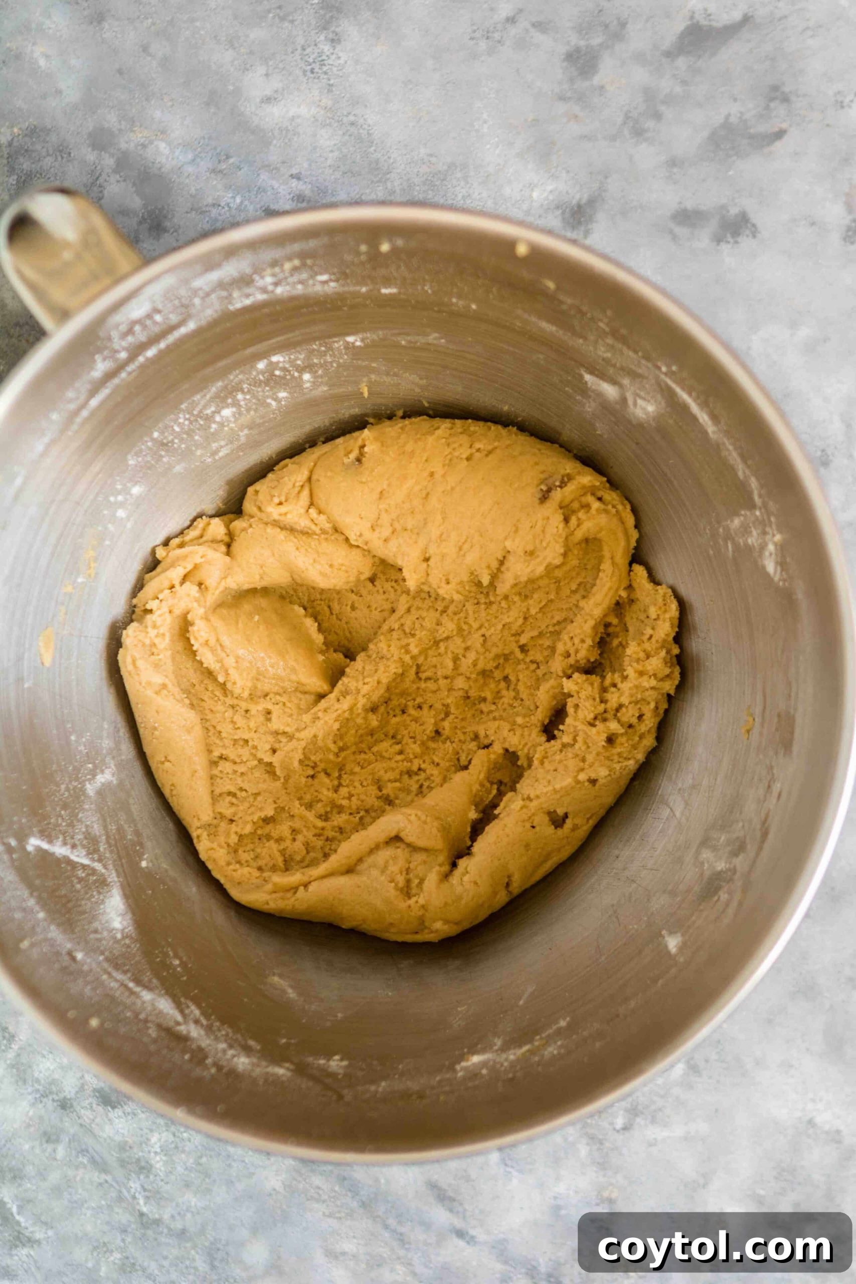 Rich, Chewy Brown Sugar Cookies 5 Close-up of brown sugar cookie dough in a mixing bowl, ready to be scooped.