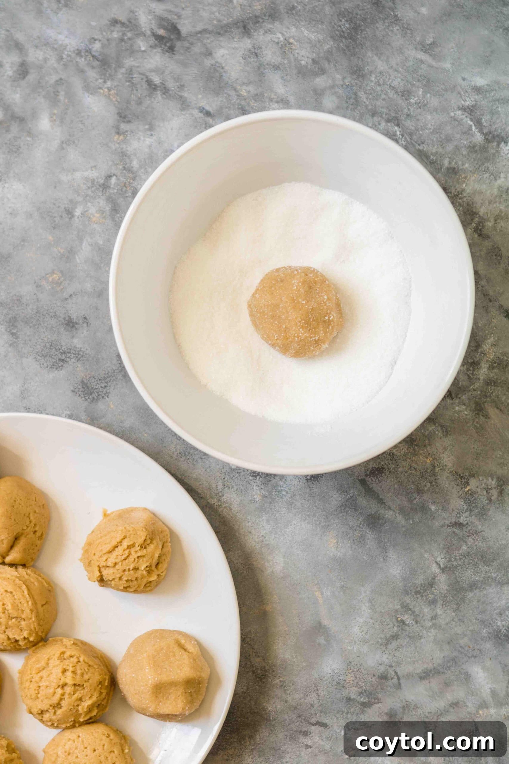 Rich, Chewy Brown Sugar Cookies 6 Perfectly portioned brown sugar cookie dough balls, coated in granulated sugar, ready for baking.
