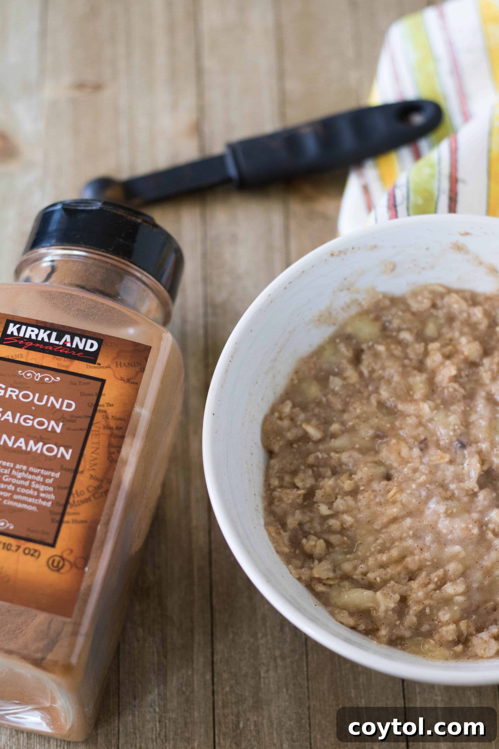 Stirred banana oatmeal after initial microwave cooking, showing creamy texture