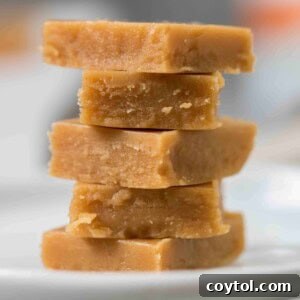 Stack of rich and creamy small batch keto peanut butter fudge squares.