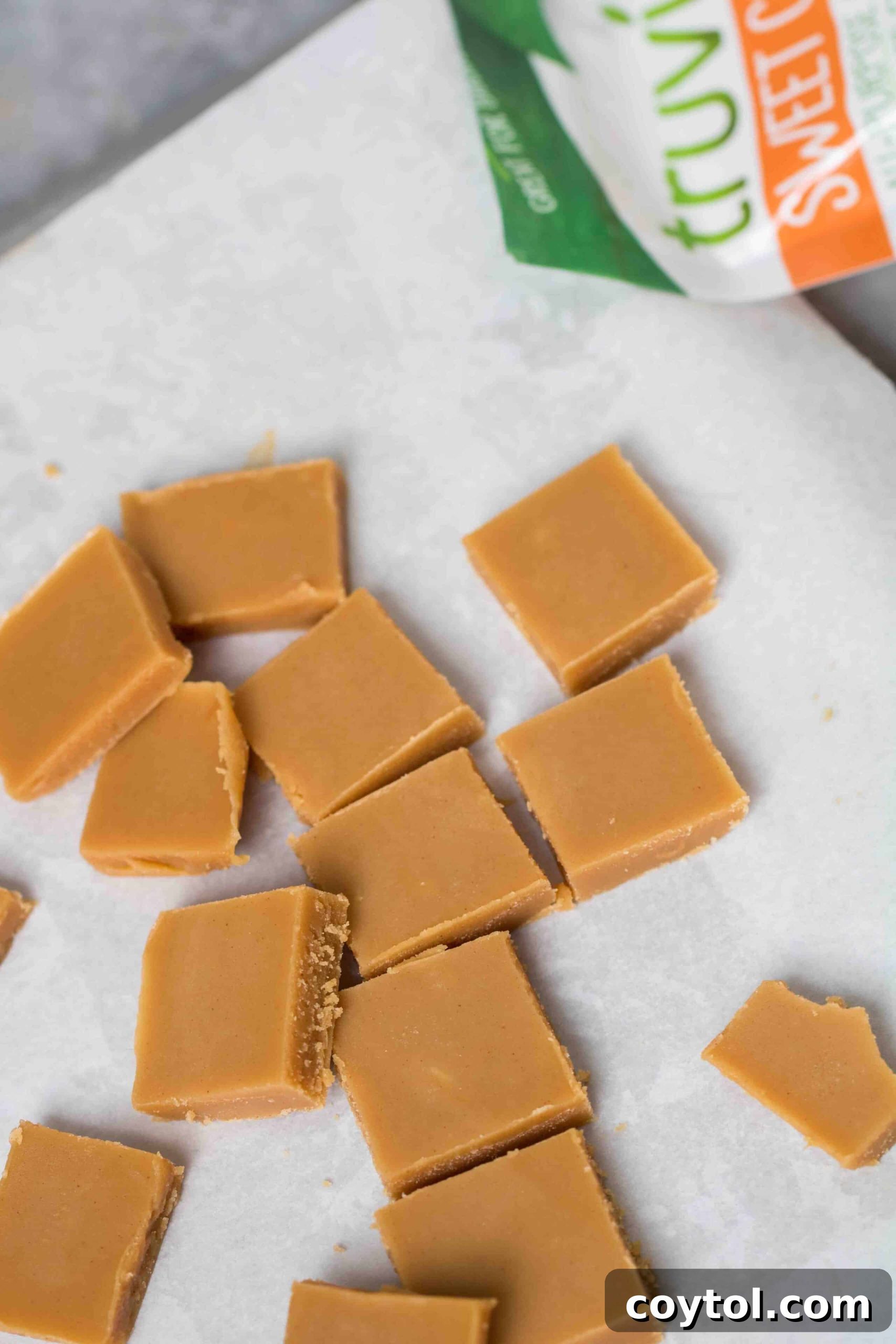 Decadent Small Batch Keto Peanut Butter Fudge 7 Freshly sliced keto peanut butter fudge squares on a plate, ready to be enjoyed.