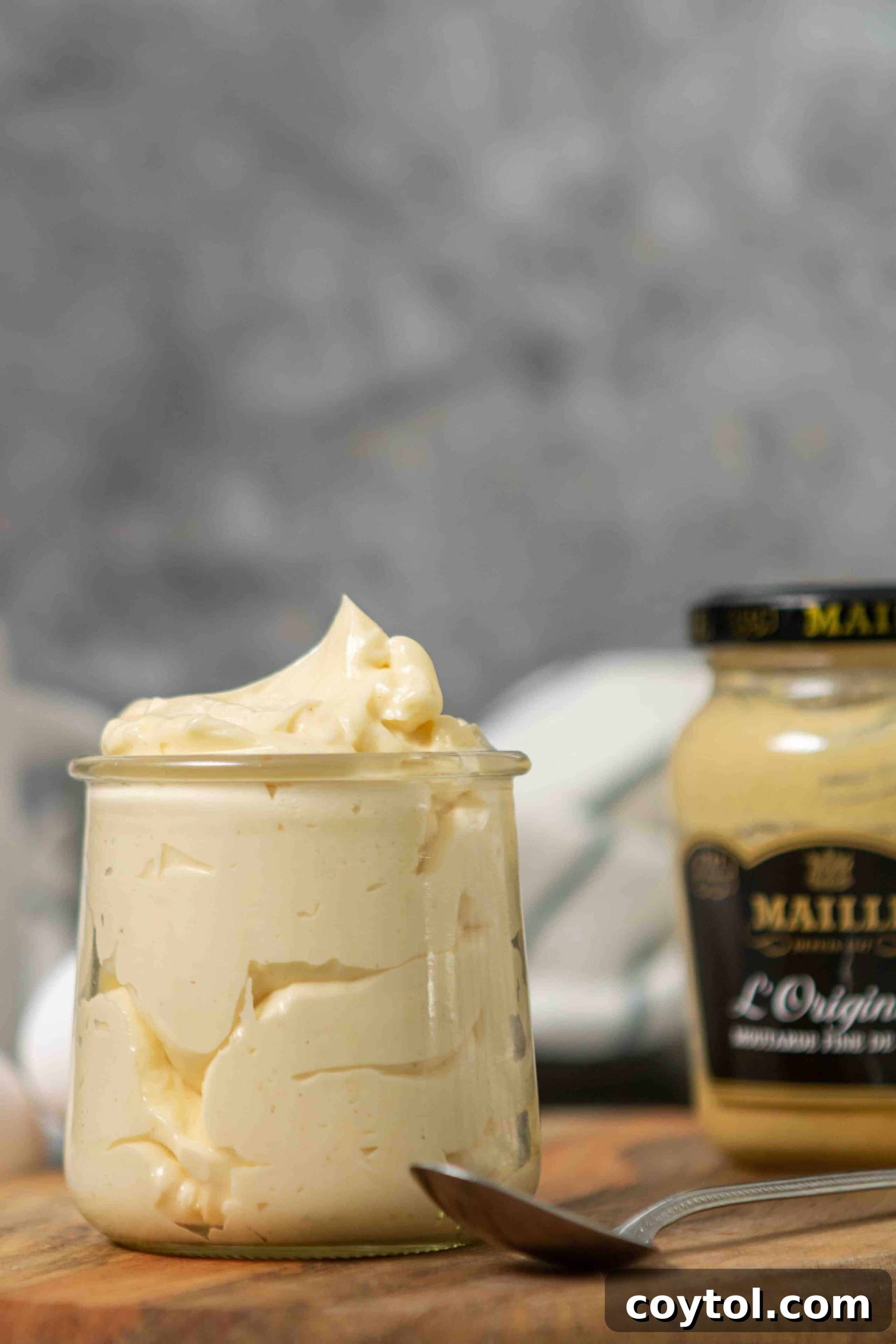 Whip Up Perfect Mayonnaise in Your Food Processor 2 The easiest homemade mayo being scooped from a jar