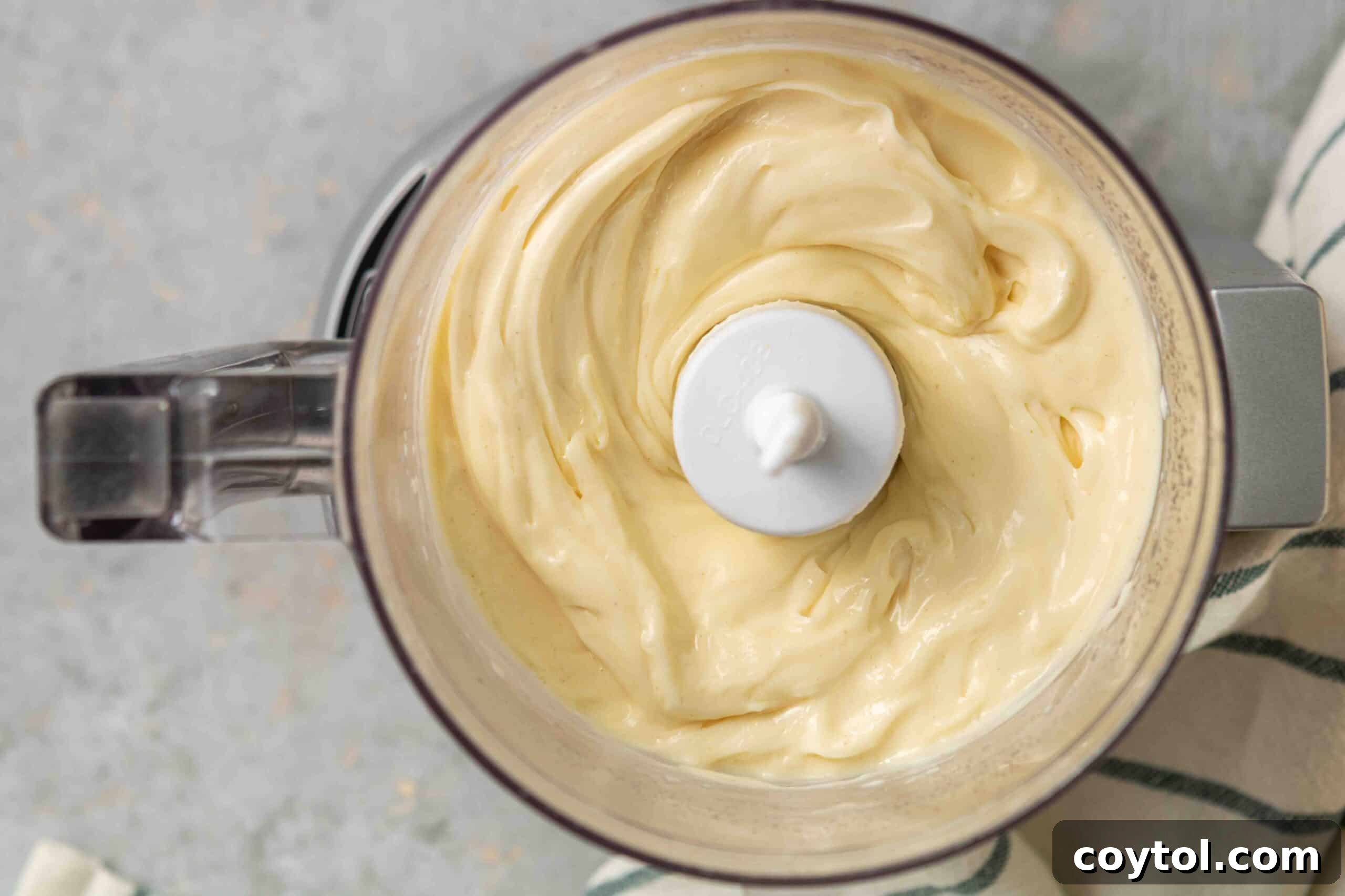 Whip Up Perfect Mayonnaise in Your Food Processor 3 Overhead shot to show the beautiful texture of homemade mayo in a jar