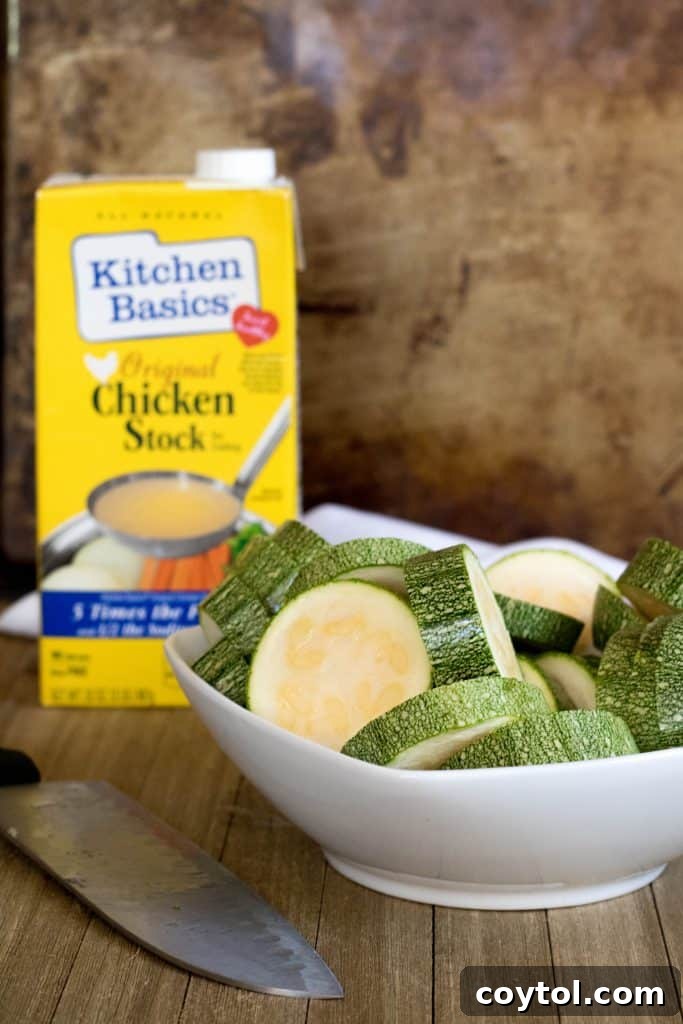 A close-up of the smooth, green texture of the Mexican squash soup in a bowl.