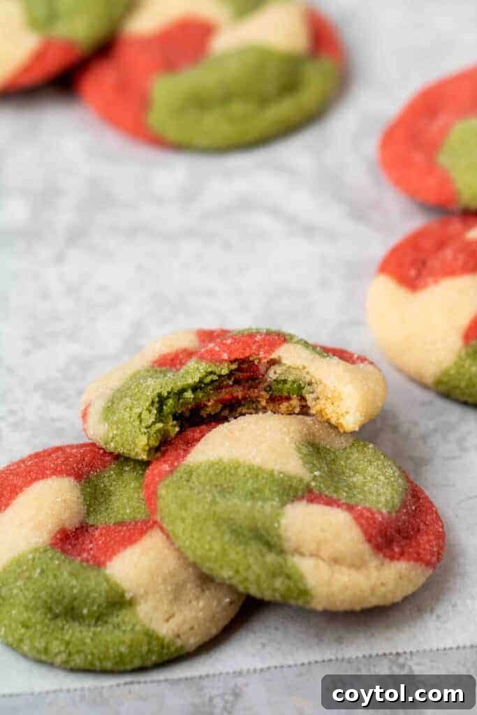 Vibrant Swirled Christmas Sugar Cookie Recipe 15 Marbled Christmas Sugar cookie with a bite taken out of it