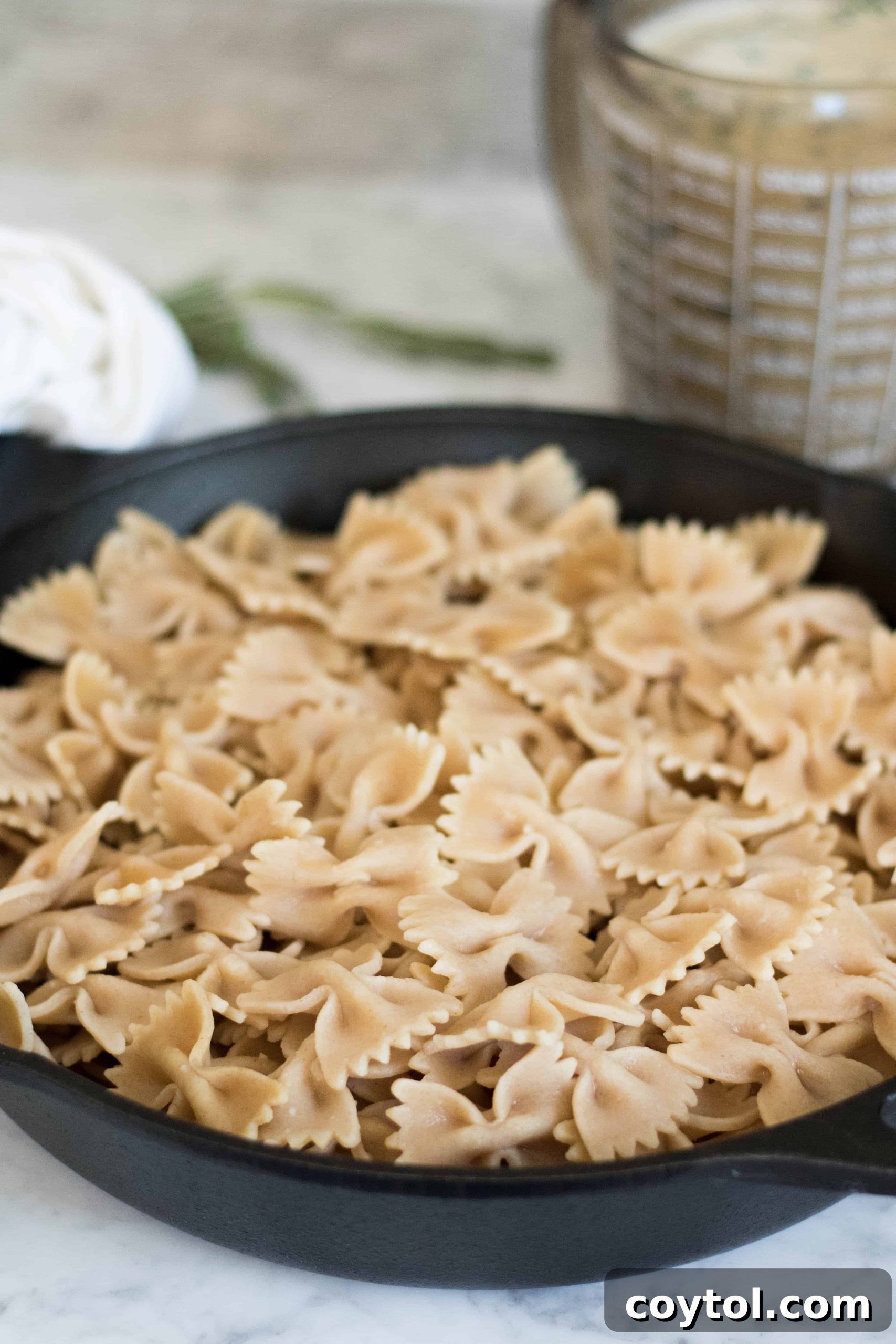 Close-up overhead shot of Vegan Kale and Mushroom pasta in a serving bowl, ready to be enjoyed.