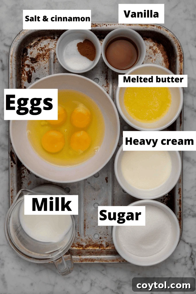Fresh ingredients laid out for Croissant French Toast Bake including eggs, milk, cream, and whole croissants