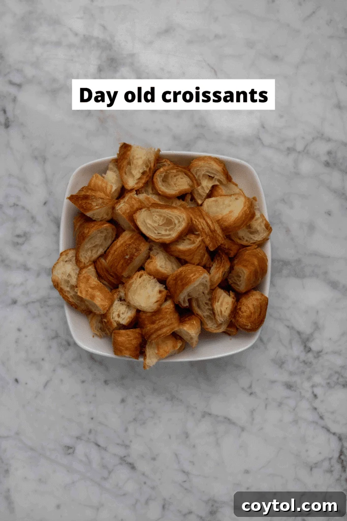 Close-up of fresh ingredients for Croissant French Toast Bake, highlighting sugar, cinnamon, and vanilla