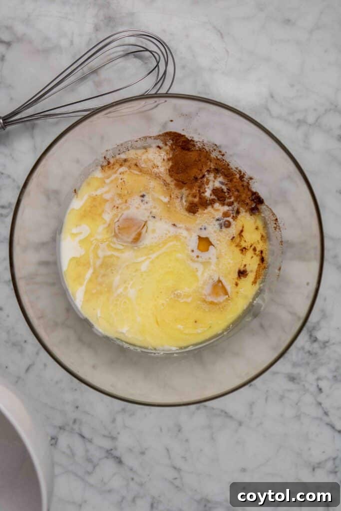 Whisking eggs in a bowl for the French toast custard