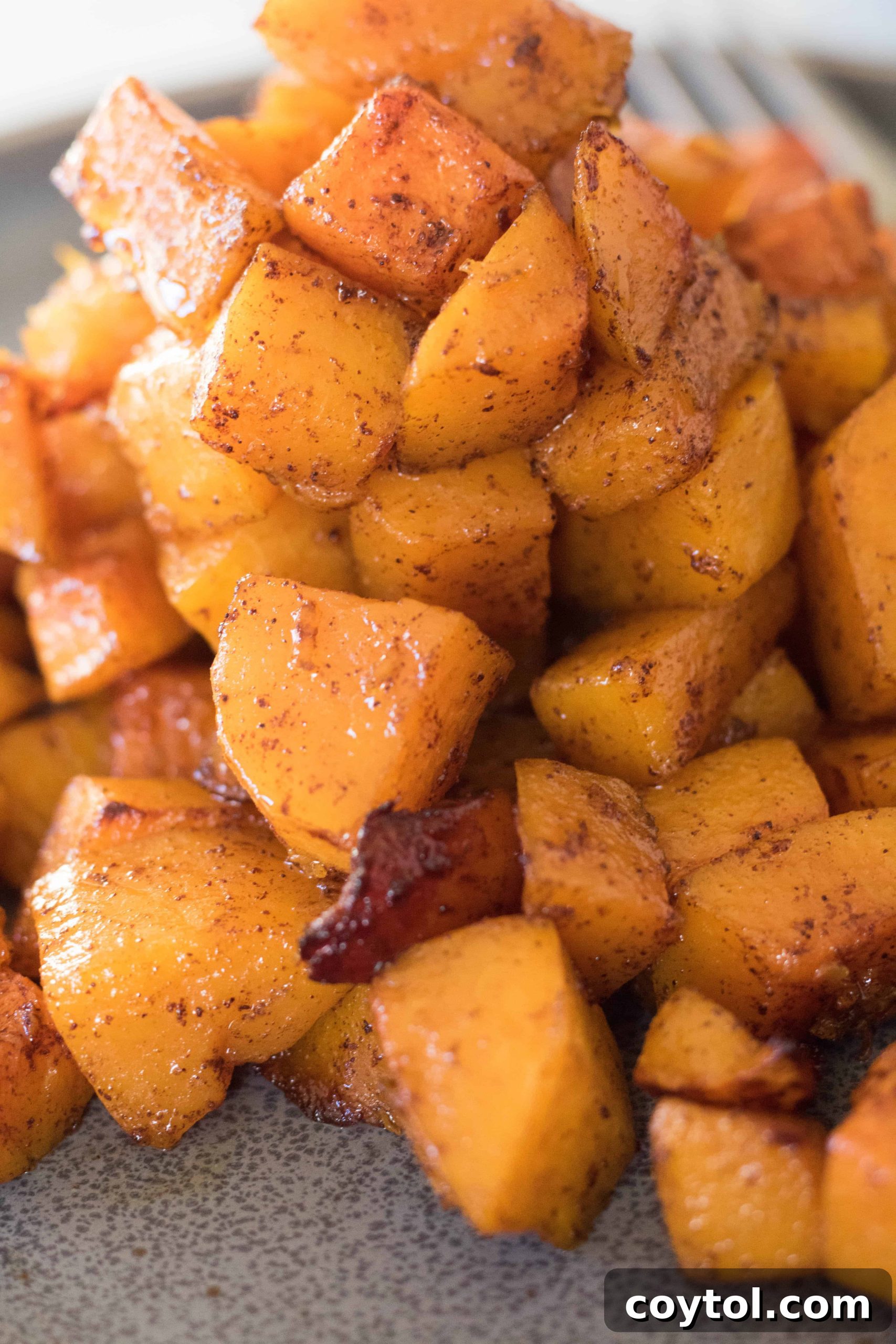 Honey roasted butternut squash for two, garnished with fresh herbs