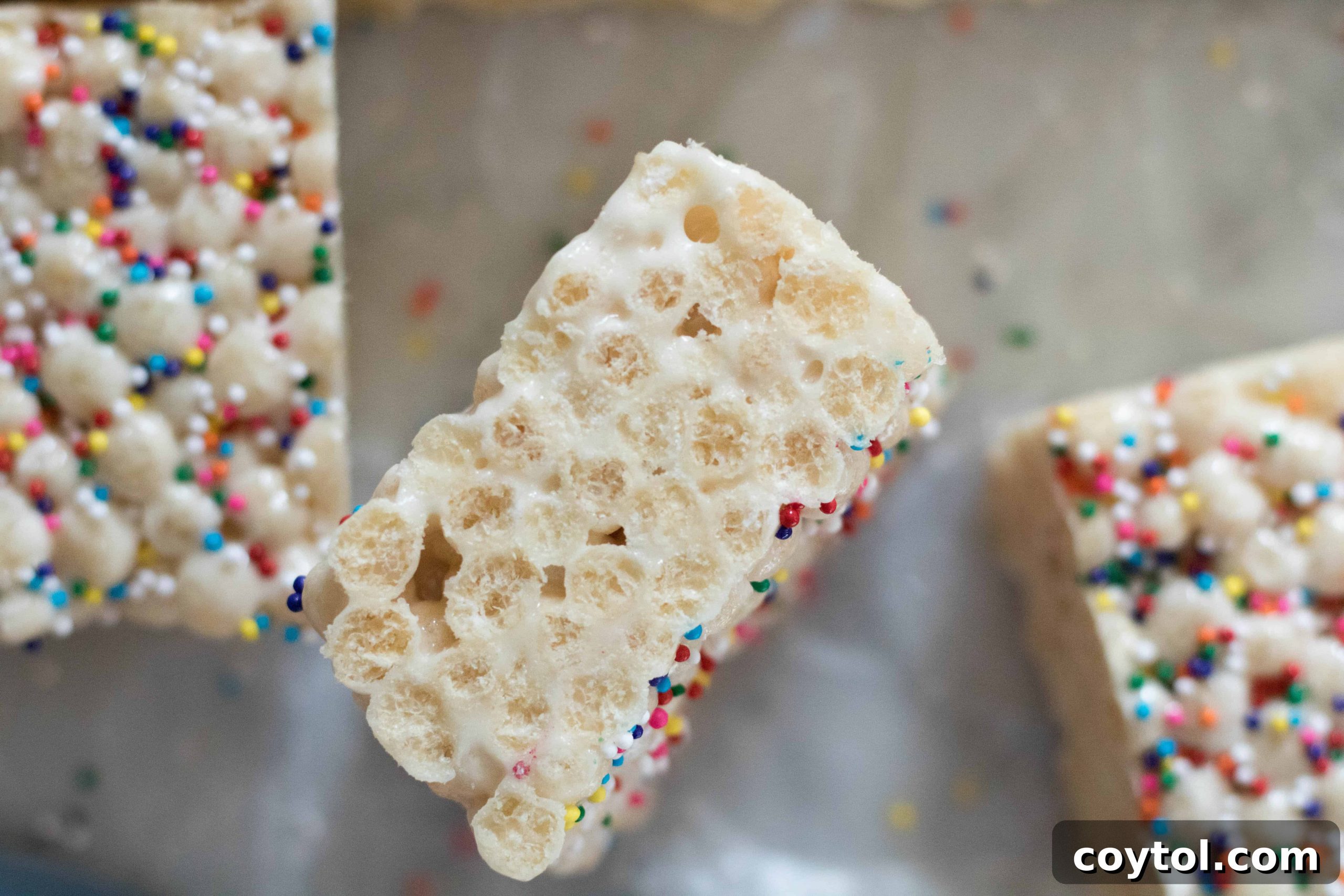 A bowl of uncooked quinoa pops, highlighting their light and airy texture.