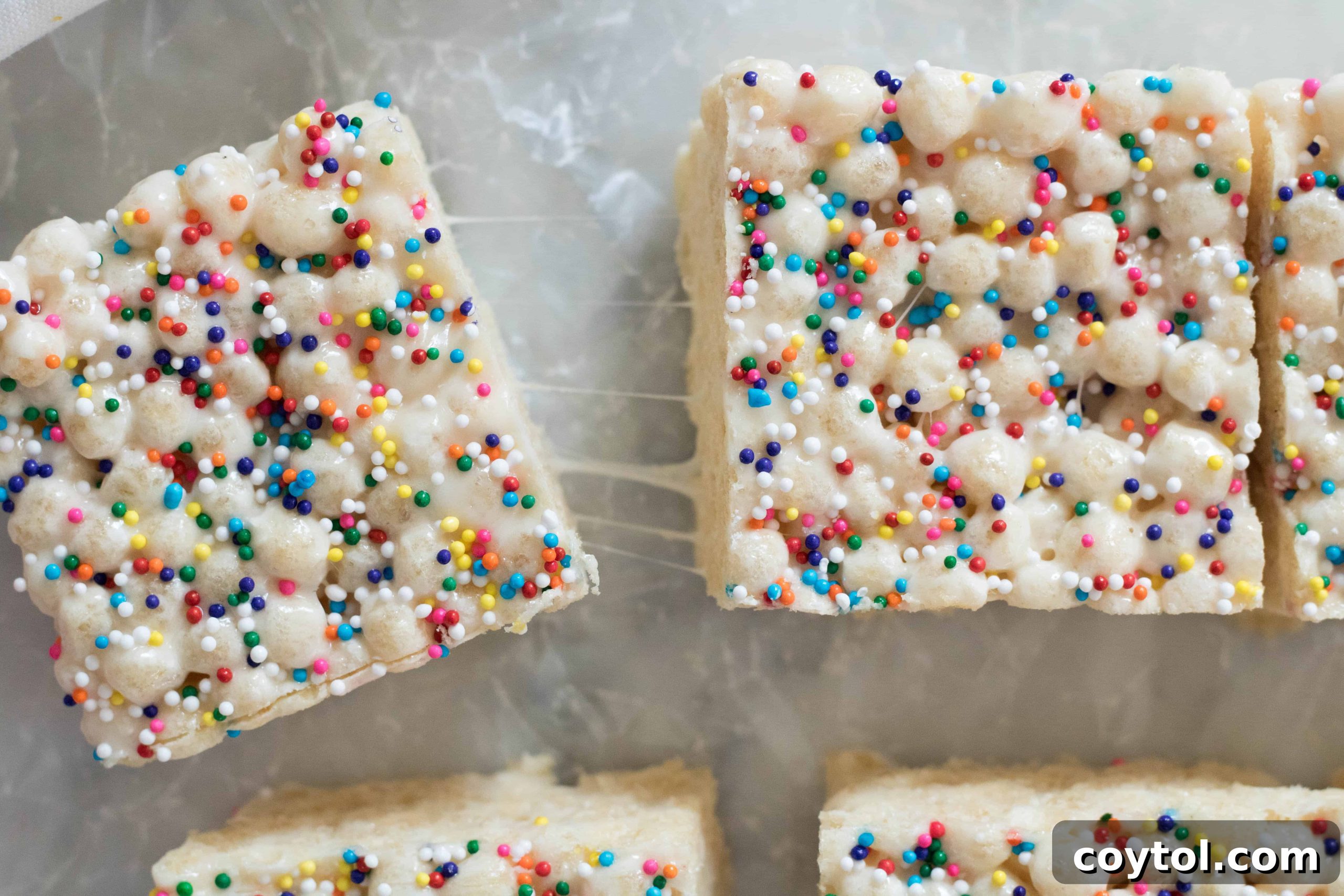 A stack of golden-brown Quinoa Pop Krispie Treats on a white plate.