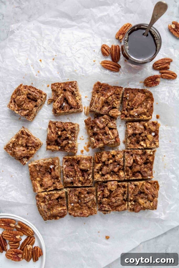 Overhead shot of the sliced healthy pecan pie bars, elegantly arranged.