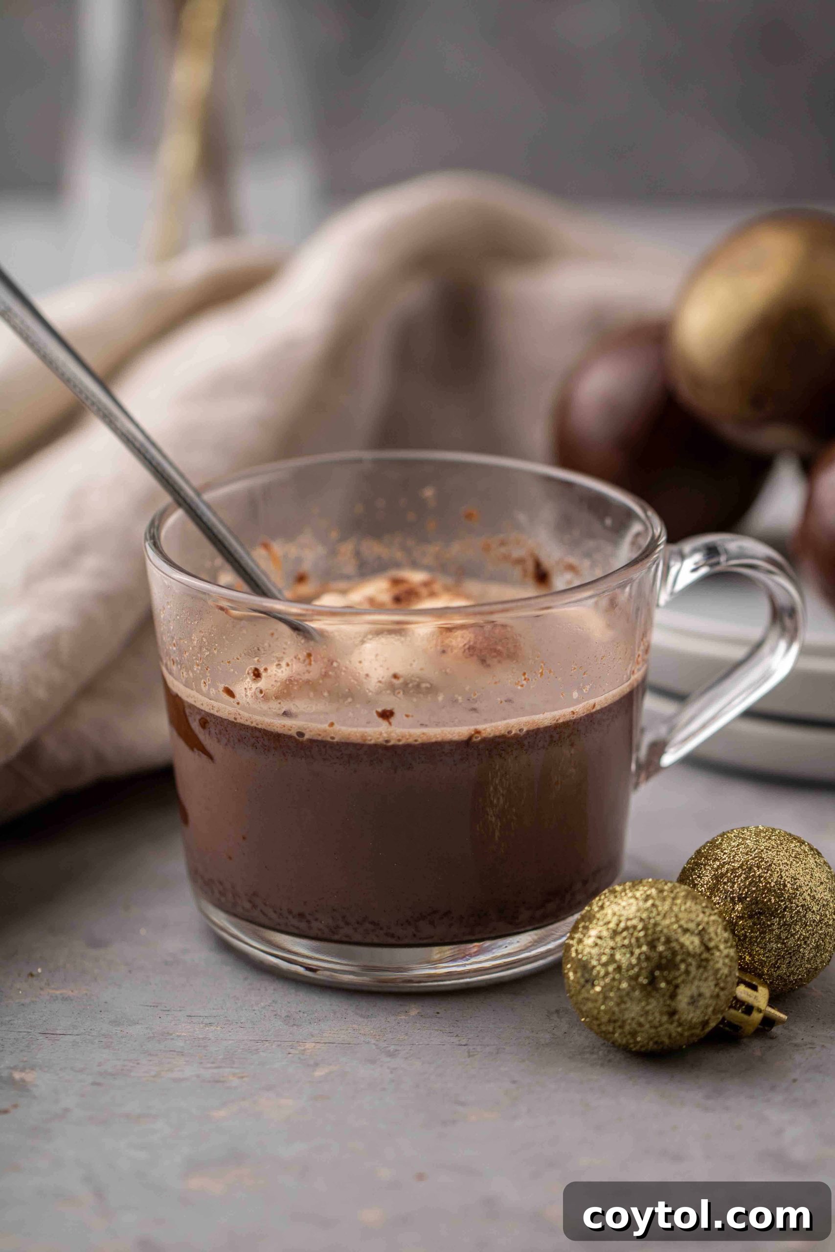 Hot chocolate bomb drink revealing marshmallows and cocoa