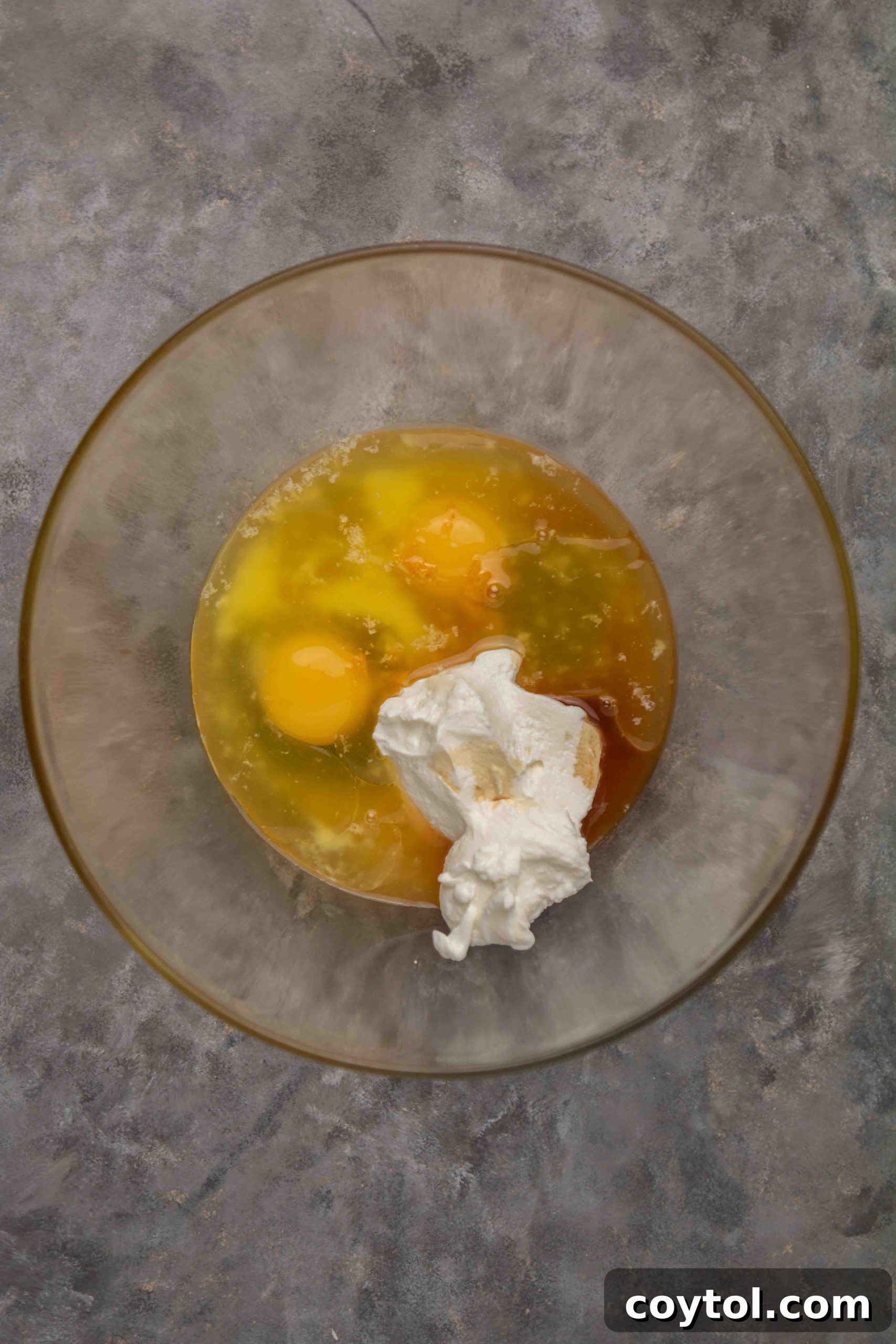 Cranberry orange muffin batter being mixed