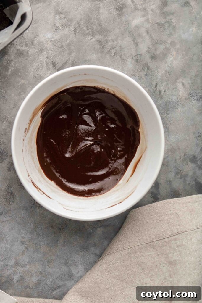 Step-by-step image showing coconut cream mixed with chocolate chips