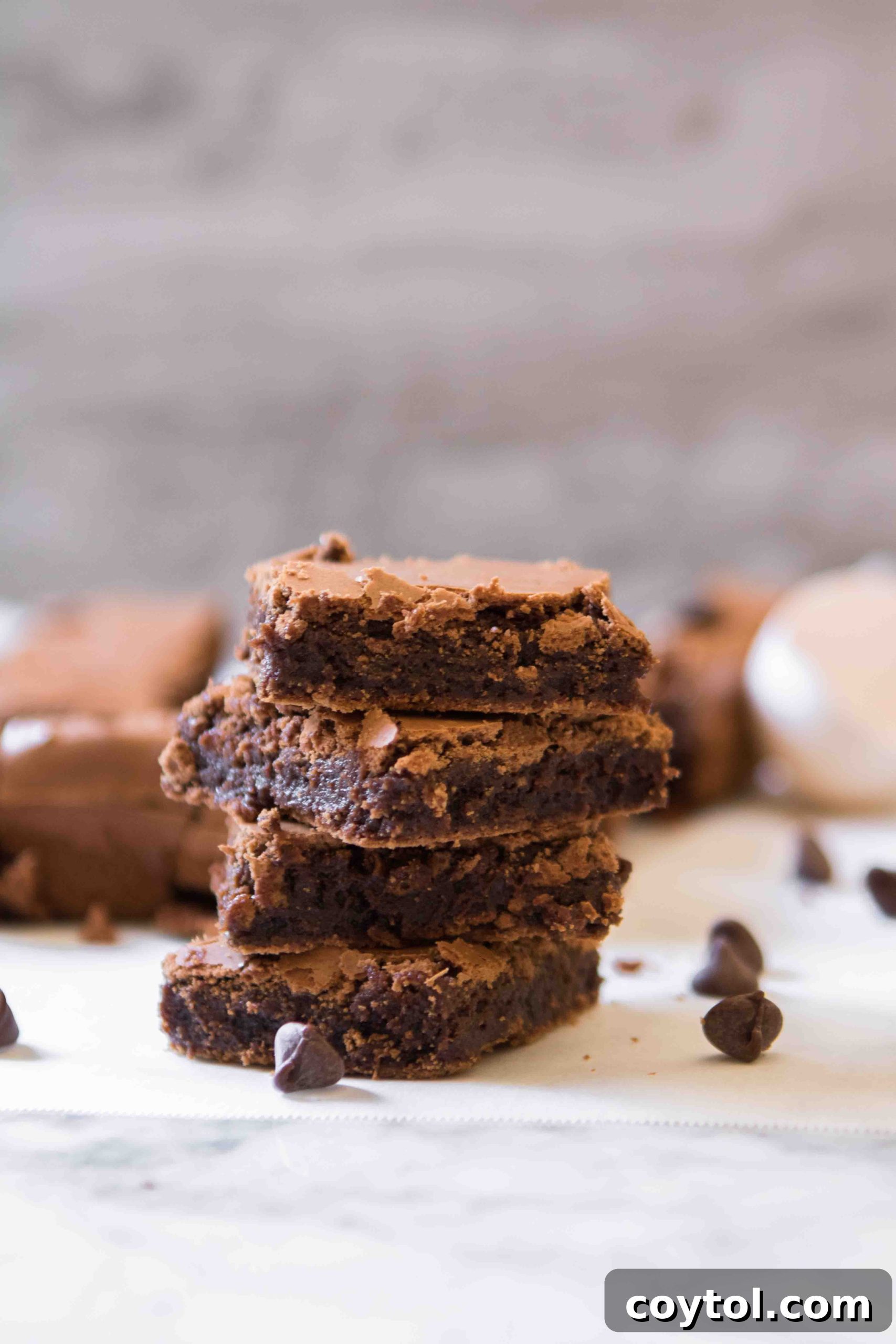 Easy brownie recipe without cocoa powder, showing a single perfect square cut from a batch.