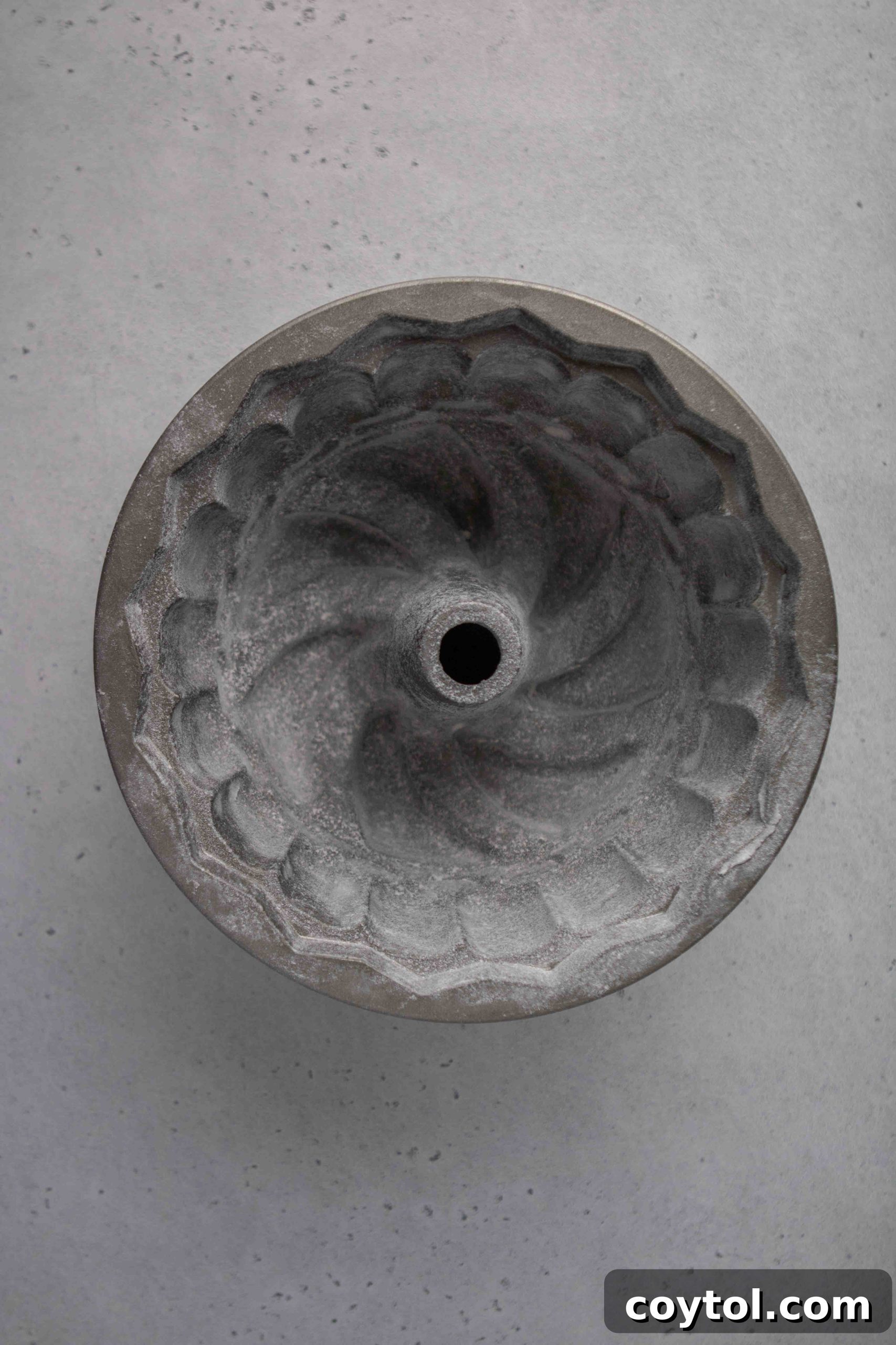 The Ultimate Not-Too-Sweet Bundt Cake 15 Preparing bundt cake pan by greasing and flouring