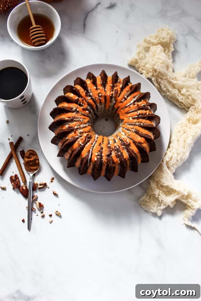 Delicious pumpkin pecan bundt cake with brown butter maple glaze