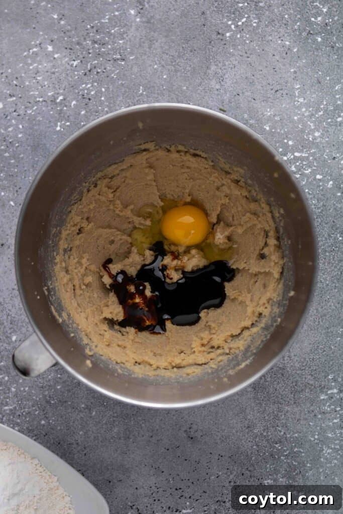 Step-by-step image of dry ingredients being folded in
