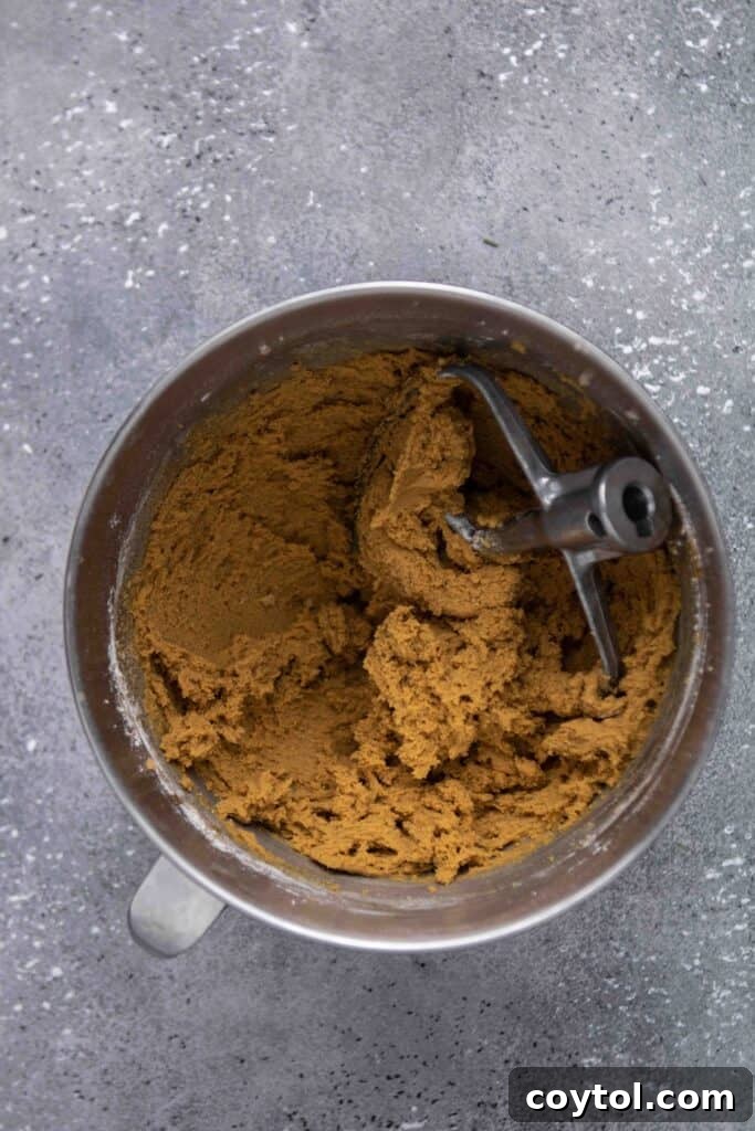 Step-by-step image of placing sugared cookie dough on baking sheet