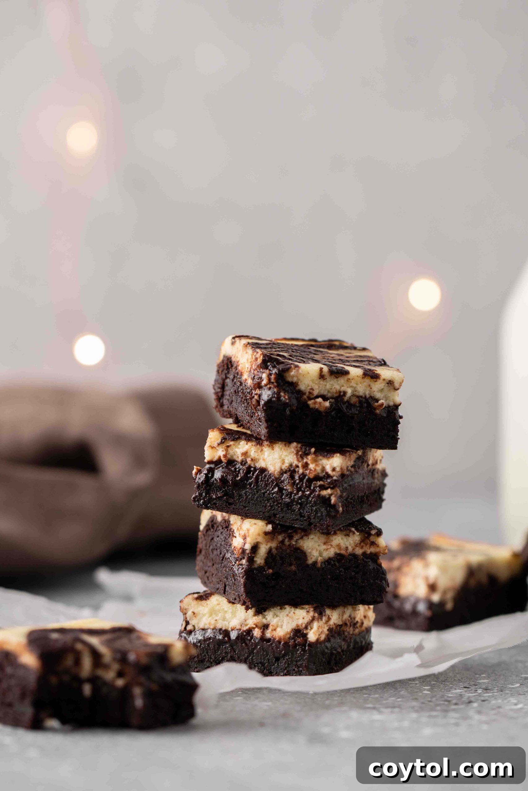 Decadent Fudgy Cheesecake Brownies 2 Stack of perfectly chewy cream cheese brownies with a distinct swirl pattern